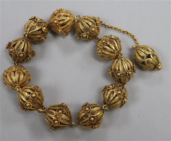 A silver gilt filligree sphere bracelet.